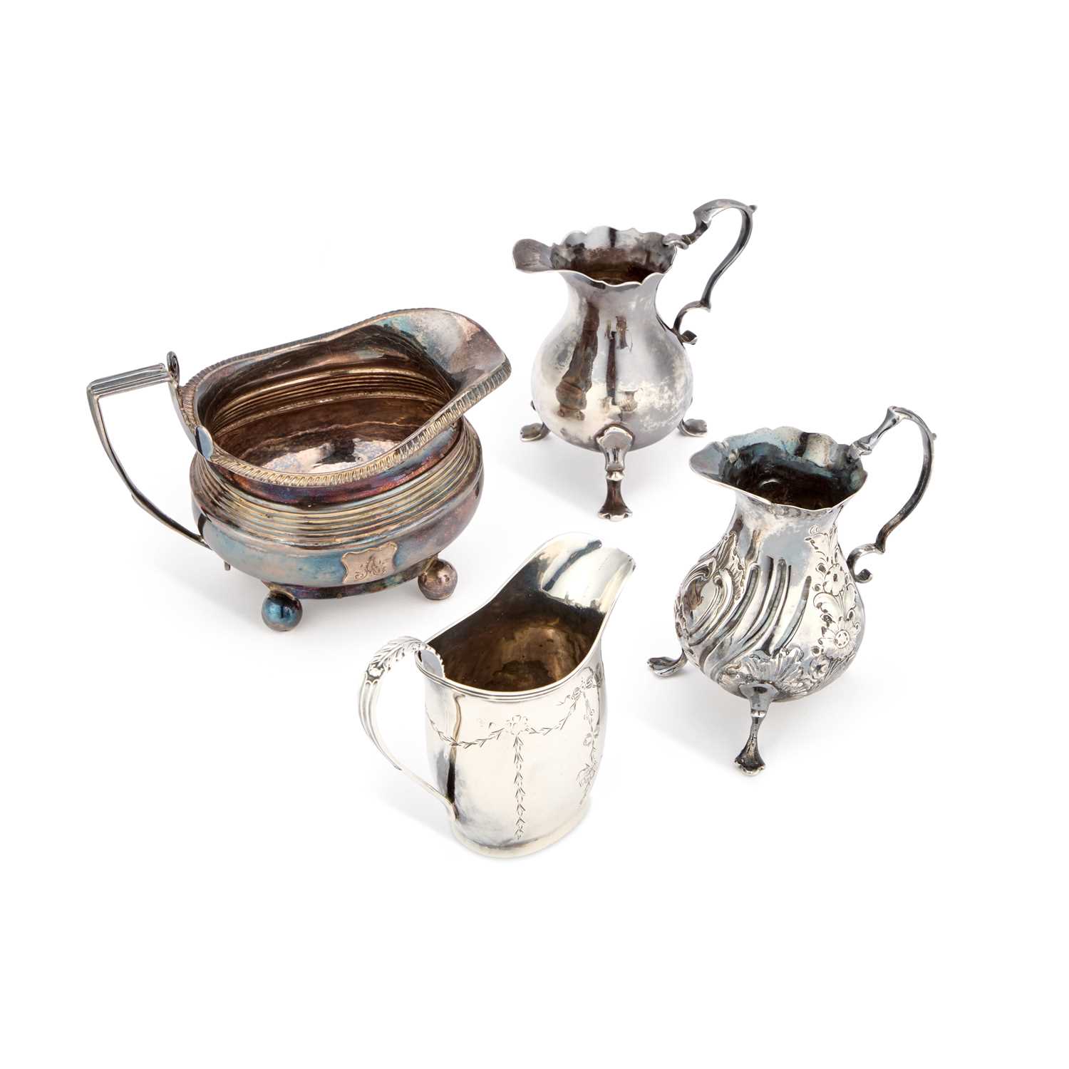 Lot 348 - FOUR SILVER CREAM JUGS