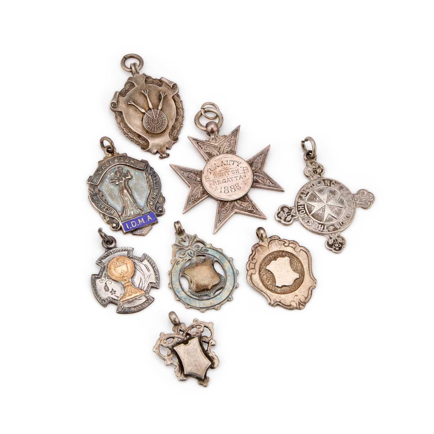 Lot 330 - A GROUP OF SEVEN SILVER FOBS/ MEDALLIONS
