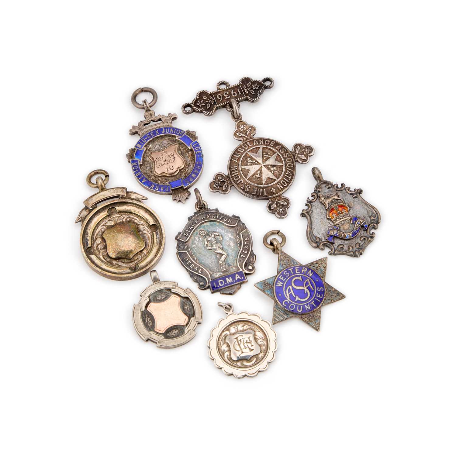 Lot 324 - A GROUP OF SILVER FOBS/ MEDALLIONS