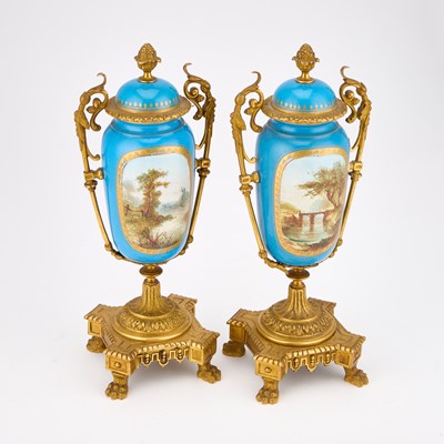 Lot 38 - A PAIR OF GILT-METAL MOUNTED SEVRES STYLE PORCELAIN URNS