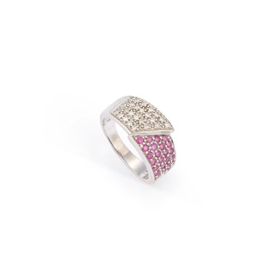 Lot A 9 CARAT WHITE GOLD RUBY AND DIAMOND CROSSOVER BAND RING