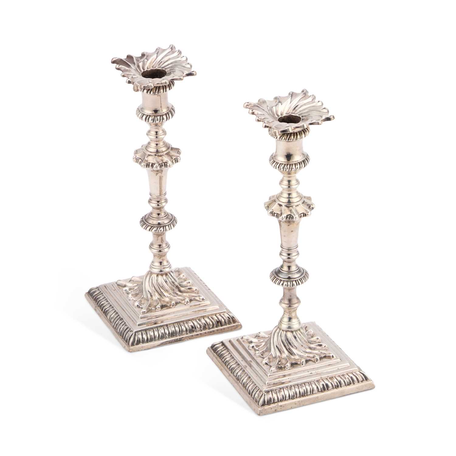 Lot 511 - A PAIR OF GEORGE III CAST SILVER TAPERSTICKS