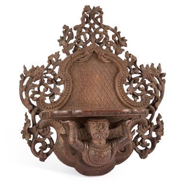 Lot 569 - AN ANGLO-BURMESE CARVED WOOD WALL BRACKET