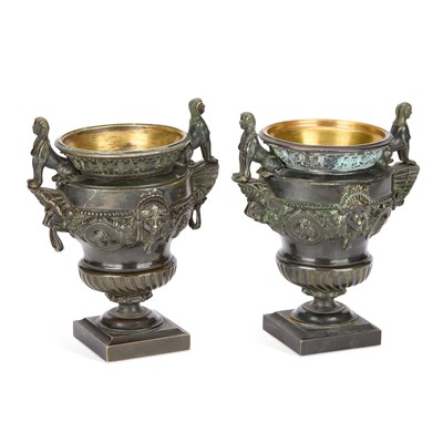 Lot 836 - A PAIR OF EMPIRE STYLE PATINATED BRONZE URNS