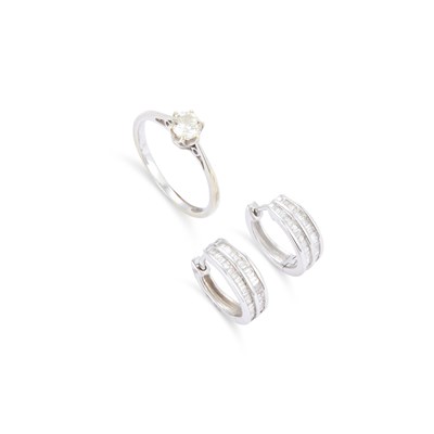 Lot 721 - A SOLITAIRE DIAMOND RING AND A PAIR OF 9 CARAT WHITE GOLD DIAMOND HOOP EARRINGS