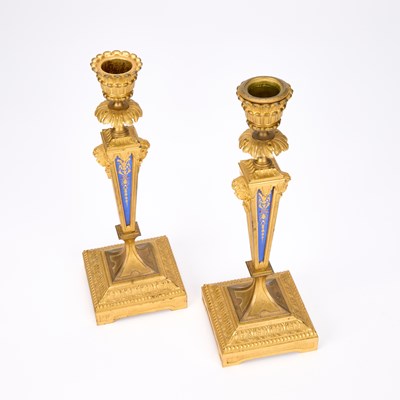 Lot A PAIR OF LOUIS XVI STYLE ORMOLU AND BLUE ENAMEL CANDLESTICKS