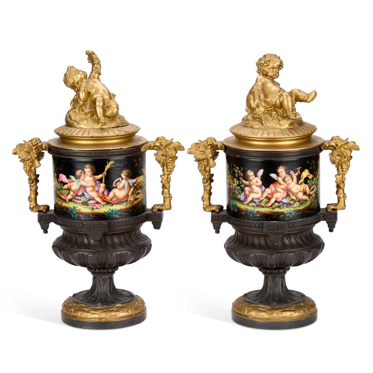 Lot A PAIR OF FRENCH PATINATED AND GILT BRONZE URNS