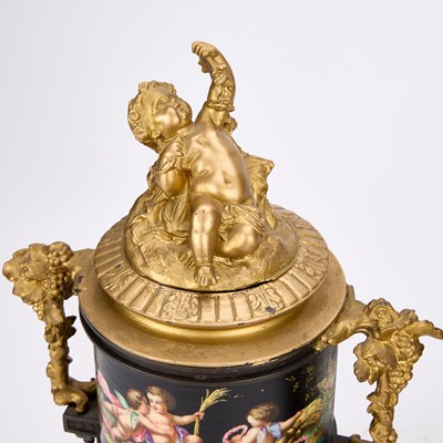 Lot A PAIR OF FRENCH PATINATED AND GILT BRONZE URNS