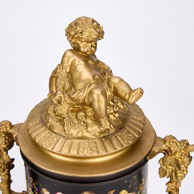 Lot A PAIR OF FRENCH PATINATED AND GILT BRONZE URNS