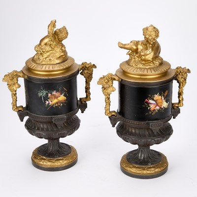 Lot A PAIR OF FRENCH PATINATED AND GILT BRONZE URNS