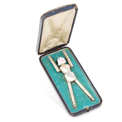 Lot 399 - A PAIR OF GEORGE V SILVER AND ENAMEL NOVELTY SUGAR TONGS