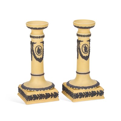 Lot 137 - A PAIR OF WEDGWOOD YELLOW GROUND CANDLESTICKS, C.1900