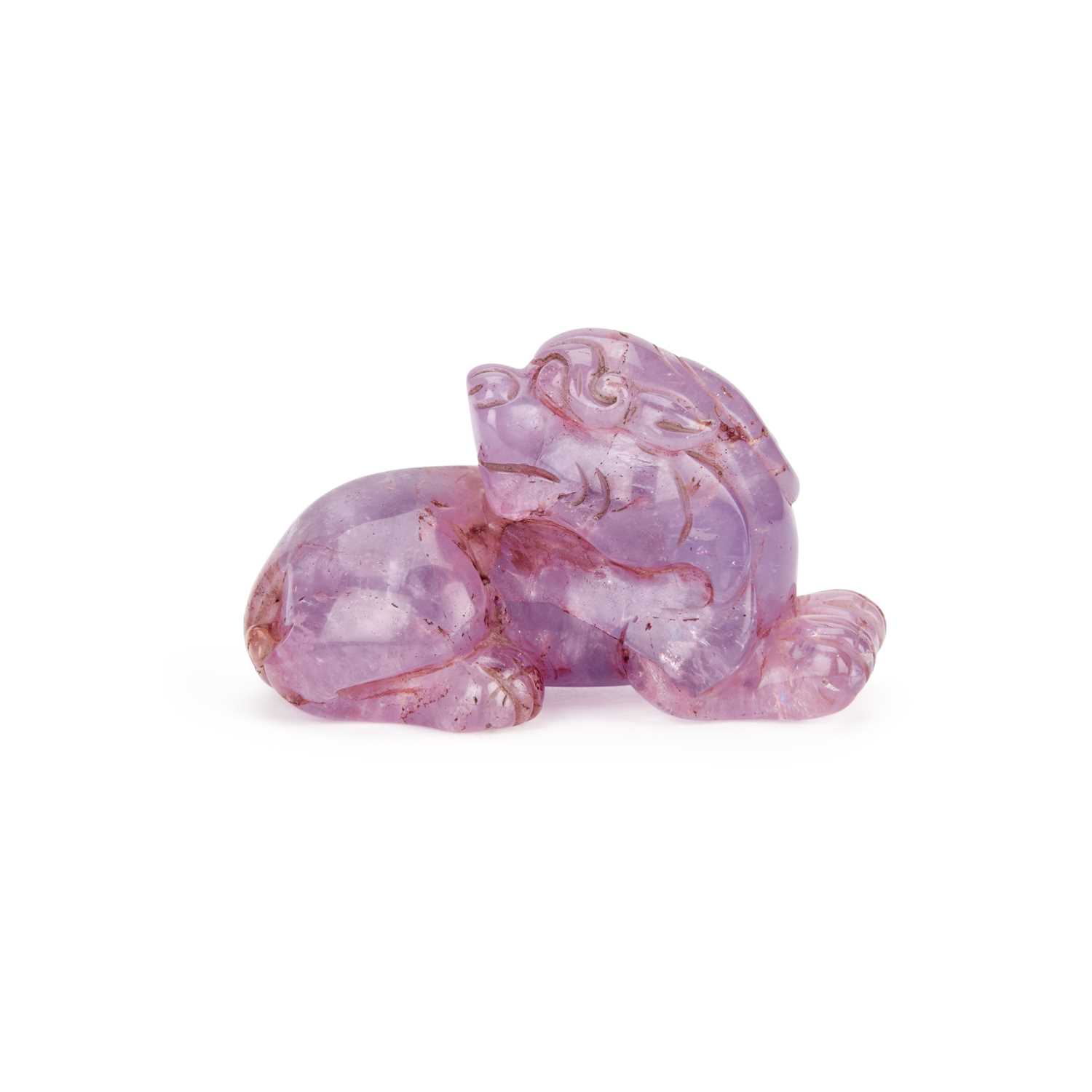 Lot A CHINESE AMETHYST CARVED LION DOG