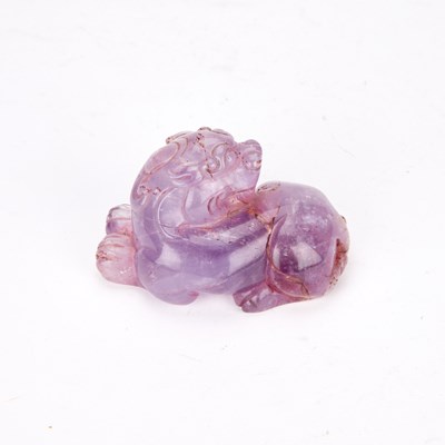 Lot A CHINESE AMETHYST CARVED LION DOG
