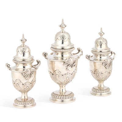 Lot 487 - A SET OF THREE GEORGE II SILVER CONDIMENT VASES