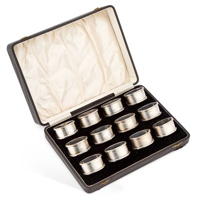 Lot 372 - A SET OF TWELVE EDWARD VIII SILVER NAPKIN RINGS