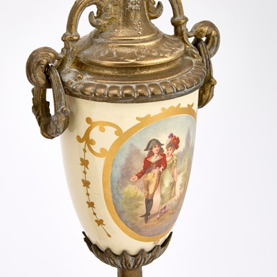 Lot A FRENCH GILT-METAL AND PORCELAIN THREE-PIECE CLOCK GARNITURE