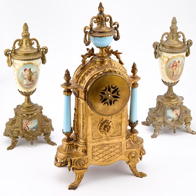 Lot A FRENCH GILT-METAL AND PORCELAIN THREE-PIECE CLOCK GARNITURE