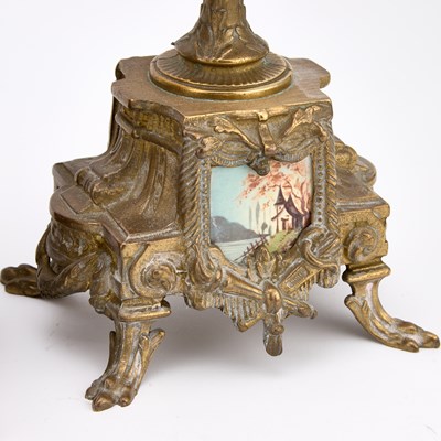 Lot A FRENCH GILT-METAL AND PORCELAIN THREE-PIECE CLOCK GARNITURE