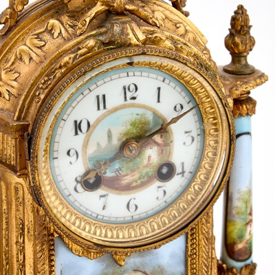 Lot A FRENCH GILT-METAL AND PORCELAIN THREE-PIECE CLOCK GARNITURE